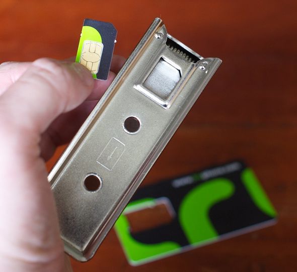 Once you've popped the SIM card out of its credit-card sized carrier, you slide it into the slot of the SIM card cutter...